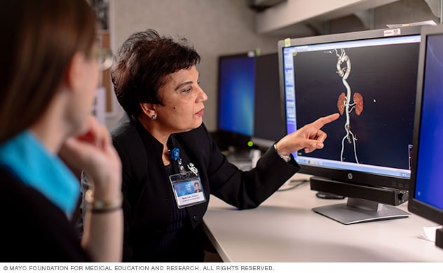 Vascular center doctors review a patient's scans.